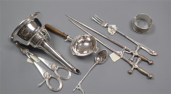 A George III silver mote spoon, a napkin ring, a tea strainer, pair of plated sword skewers, a wine funnel and a pair of grape shears